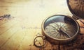 Old compass on vintage map. Adventure stories background. Royalty Free Stock Photo