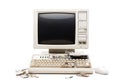 An old computer with a damaged keyboard and mouse, possibly out of use Royalty Free Stock Photo