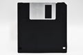 Old computer and data storage technology, black magnetic floppy disk 3ÃÂ½ inches, isolated on white background Royalty Free Stock Photo