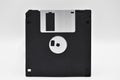 Old computer and data storage technology, black magnetic floppy disk 3ÃÂ½ inches, isolated on white background Royalty Free Stock Photo