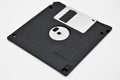 Old computer and data storage technology, black magnetic floppy disk 3ÃÂ½ inches, isolated on white background Royalty Free Stock Photo