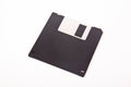 Old computer and data storage technology, black magnetic floppy disk 3ÃÂ½ inches, isolated on white background Royalty Free Stock Photo