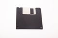 Old computer and data storage technology, black magnetic floppy disk 3ÃÂ½ inches, isolated on white background Royalty Free Stock Photo