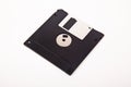 Old computer and data storage technology, black magnetic floppy disk 3ÃÂ½ inches, isolated on white background