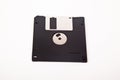 Old computer and data storage technology, black magnetic floppy disk 3ÃÂ½ inches, isolated on white background Royalty Free Stock Photo