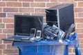 Old hardware put into a recycling container.