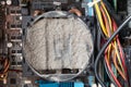 Old computer system unit cooler with dust inside. Dust on the computer pc processor cooler with computer case fragment Royalty Free Stock Photo