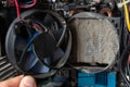 Old computer system unit cooler with dust inside. Dust on the computer pc processor cooler with computer case fragment Royalty Free Stock Photo