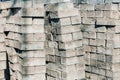 Old concrete bricks stacked in a row. Paving tiles background Royalty Free Stock Photo