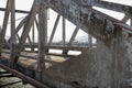 Old concrete bridge in sunlight. Rustic concrete piles silhouette. Road crossing river. Solid bridge construction