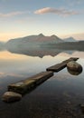 Mirror-like reflections of Cumbrian mountains with beautiful blue morning sky. Taken at Derwentwater in the Lake District, UK.