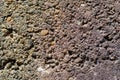 Old concrete wall with round gravel pebbles for background texture Royalty Free Stock Photo