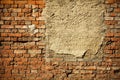 Old concreted boarded up window on a derelict red brick wall