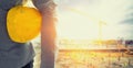 Old construction helmets with Worker in a construction site Royalty Free Stock Photo