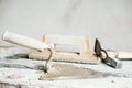 Old construction tools for plaster on vintage wood bench. Trowels and other masonry tools. Copy, empty space for text