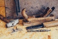 Old construction tools on a wooden workbench flat lay background. Carpenter table. Woodwork Royalty Free Stock Photo