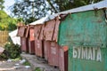 Old containers for collecting garbage on the street in Russia Royalty Free Stock Photo