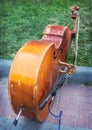 Old contrabass on sidewalk Royalty Free Stock Photo