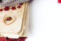 Old cooking book on white background with anise and red garland .