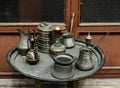 Old copper jug, ladle and bowl standing on a tray Royalty Free Stock Photo