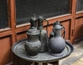 Old copper jug, ladle and bowl standing on a tray Royalty Free Stock Photo