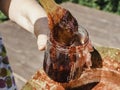 Old, copper pan, wooden spoon and plum jam Royalty Free Stock Photo