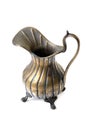 Old copper pitcher on white