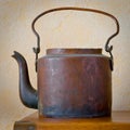 Old copper tea-pot on a table Royalty Free Stock Photo