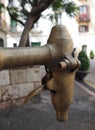 Old copper water tap. Tarragona. Royalty Free Stock Photo