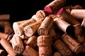 Old cork stoppers of French wines in a wire basket