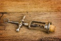 Old corkscrew with a cork Royalty Free Stock Photo