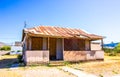 Old Corner One Level Home With Boarded Up Windows & Door Royalty Free Stock Photo