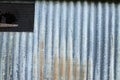 Old correlated metal sheet with opening Royalty Free Stock Photo