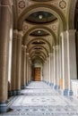 An old corridor with a beautiful floor and painted ceilings