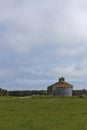 An old corrugated clad Barn and circular Grain Silo situated in the Farmlands near to Montrose Beach