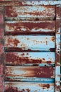 Old corrugated metal background, rusty rough surface, peeled off cracked blue paint, weather-affected material Royalty Free Stock Photo