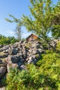 Old cottage at a stone cairn in the countryside Royalty Free Stock Photo