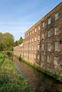 Old cotton mill beside river