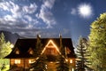 Old country house against sky. Shining moon.