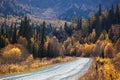 Old country road in autumn mountain forest Royalty Free Stock Photo