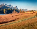 Old country road on the shore of Wagenbruchsee Geroldsee lake with Zugspitze mountain range Royalty Free Stock Photo