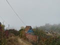 Old countyside house. Foggy autumn day Royalty Free Stock Photo