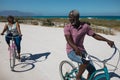 Old couple with bikes at the beach Royalty Free Stock Photo