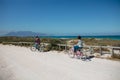 Old couple with bikes at the beach Royalty Free Stock Photo