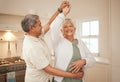 Old couple, dancing in kitchen with love and bonding, love and energy with support and life partner in marriage