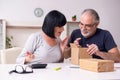 Old couple doing the online shopping Royalty Free Stock Photo