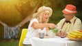 The Old Couple Is Drinking Cold Lemonade In The Summer Garden Royalty Free Stock Photo