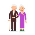 Old couple. Elderly man in suit and bow tie stands with an elderly woman who holds his hand. Grandmother and grandfather.