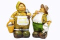 Old couple gardeners, ceramic dolls on white background, selecti