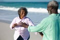 Old couple having fun at the beach Royalty Free Stock Photo